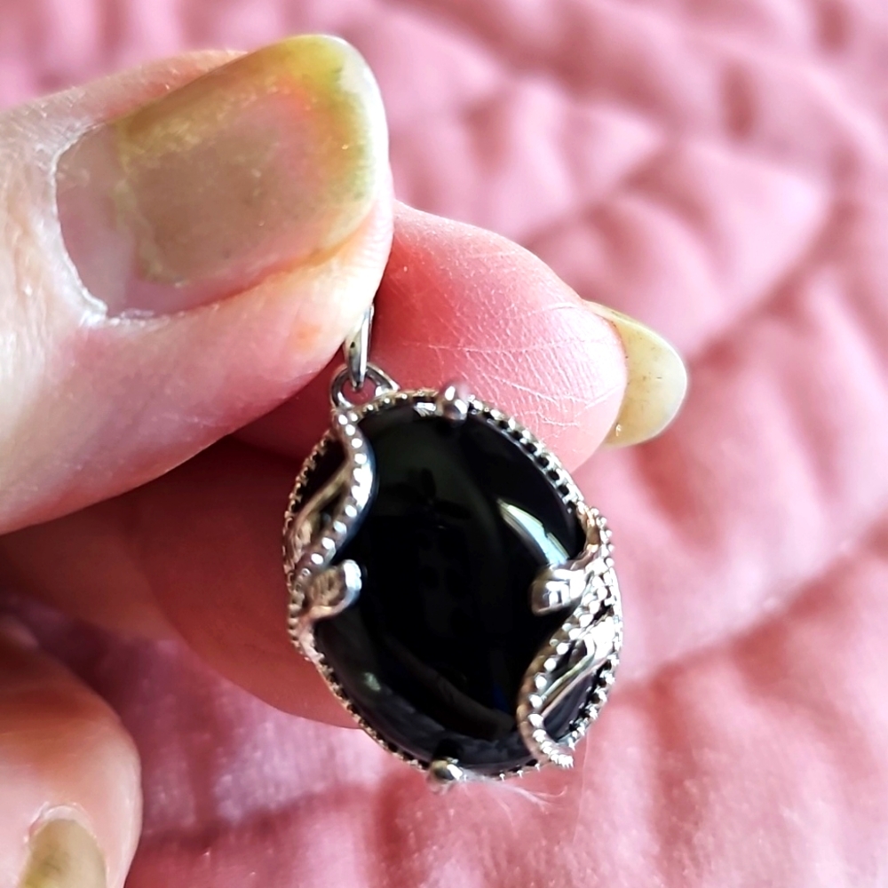 New silvertone with black onyx pendant